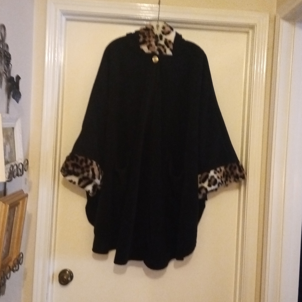 Black, Hooded w/2 pockets Cape/Jacket.  Faux Fur around the arms and the hood.